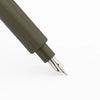 Monteverde Axis fountain pen with sleek black body and gold accents, shown with its fine metal nib.