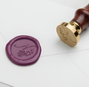 Papier Plume Wax Seal with Script Monogram design featuring elegant N initials on cream-colored wax.