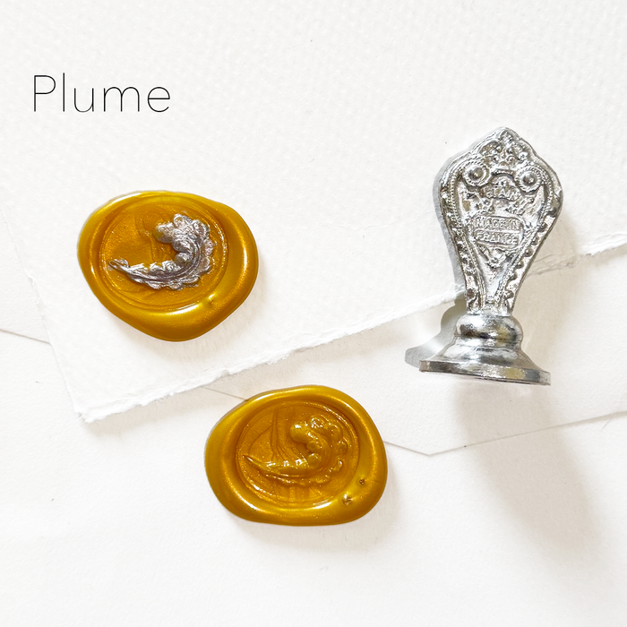 Le Potier D'etain wax seal with a feather design on a white background, showcasing a detailed wax seal stamp for sealing letters.