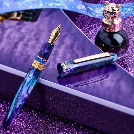 Esterbrook The Rockstar Estie fountain pen with a colorful Ferris Wheel Press design, featuring a sleek black cap and gold accents.