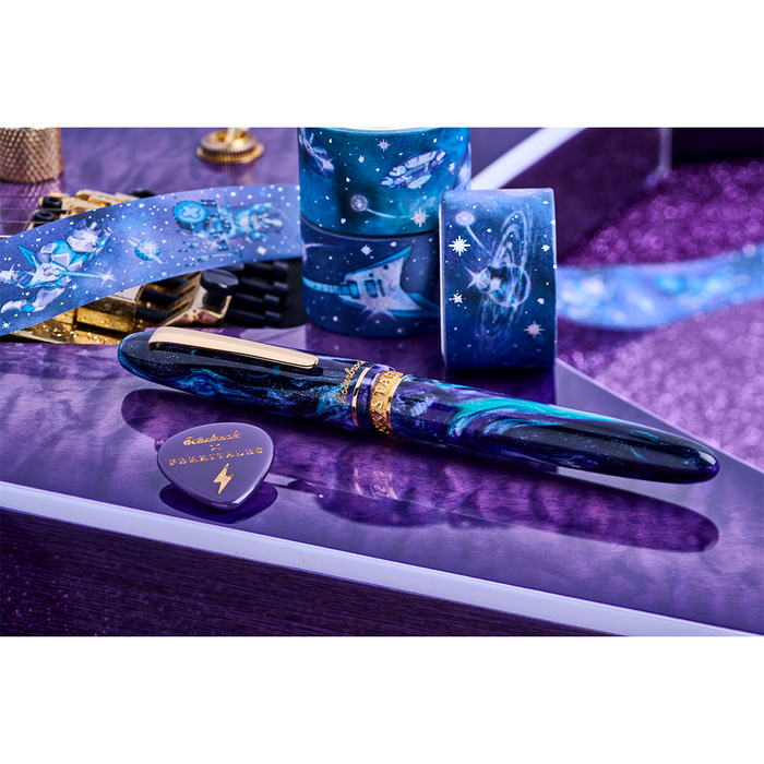 Esterbrook The Rockstar Estie fountain pen with a dark marbled finish and gold accents, displayed on a white background.
