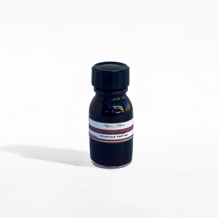 Papier Plume fountain pen ink bottle labeled Rose Rouge with red ink inside, shown on a white background.