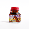 Papier Plume Rusty Rainbow shimmering fountain pen ink in a glass bottle with colorful ink swirls.