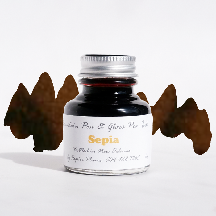 Papier Plume fountain pen ink in sepia, bottle of rich brown ink for writing and calligraphy, with ink swatch on white background.