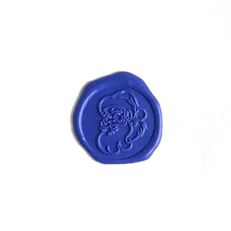 Brass wax seal stamp with Santa face symbol, designed for sealing letters and documents by Papier Plume.