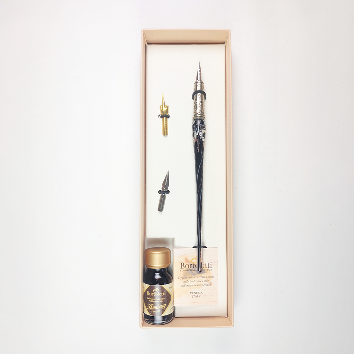 Set of 20 black Bortoletti glass dipping pens displayed together, ideal for calligraphy and artistic writing.
