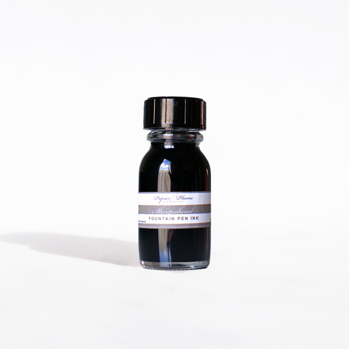 Papier Plume Sheepshead fountain pen ink in 15ml bottle, dark ink with a smooth flow for elegant writing.