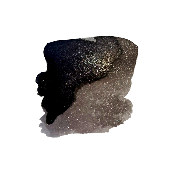 Papier Plume Southern Nights shimmer fountain pen ink bottle with dark blue and purple hues, showcasing the ink's shimmering effect.