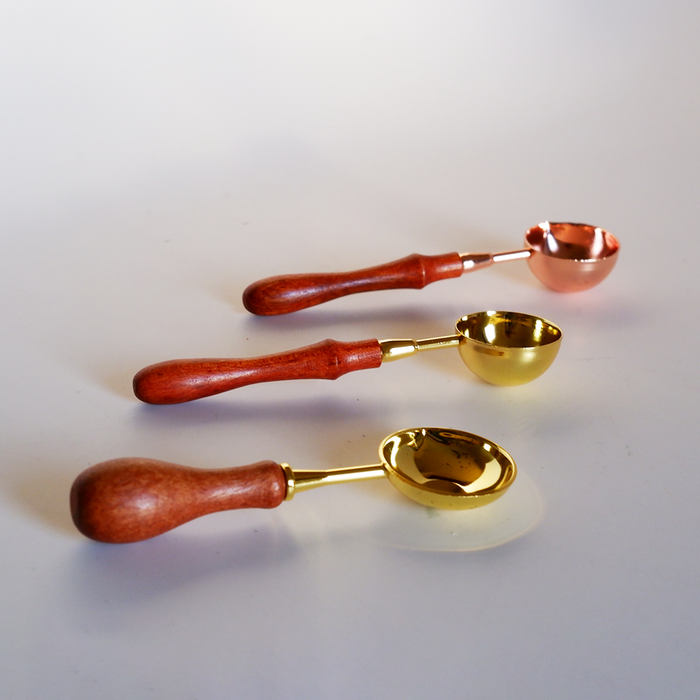 Papier Plume wax melting spoons, small metal tools for melting and applying wax, shown on a white background.