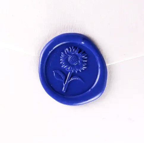 Brass wax seal stamp featuring sunflower symbol, used for sealing letters and documents, by Papier Plume.
