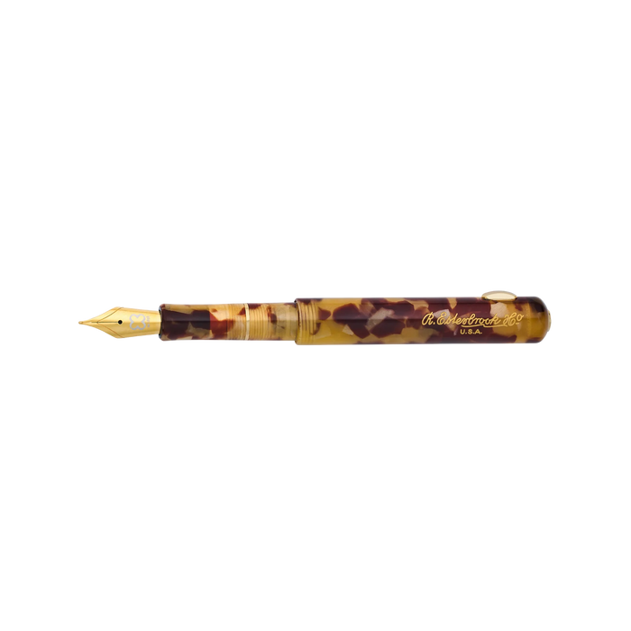 Esterbrook Niblet fountain pen with a tortoise shell-colored barrel and gold accents, open to reveal the nib and ink reservoir.