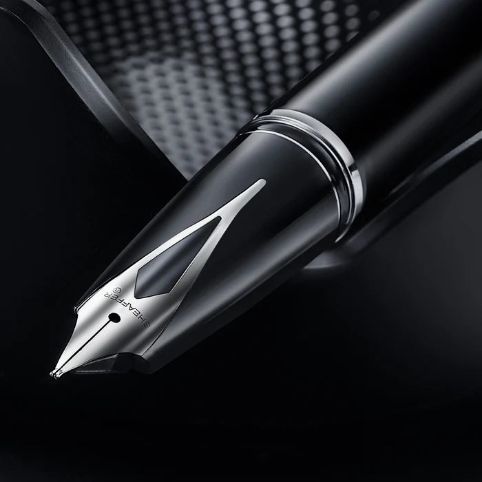 Sheaffer Legacy black fountain pen with sleek design and gold accents, featuring a smooth nib and elegant craftsmanship.