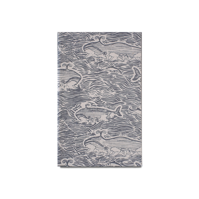 Giftsland whale-themed journal with illustrated whale designs on the cover, ideal for writing and note-taking.