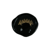 Wax seal featuring fang-shaped design by Papier Plume, showcasing intricate details and a classic sealing wax appearance.