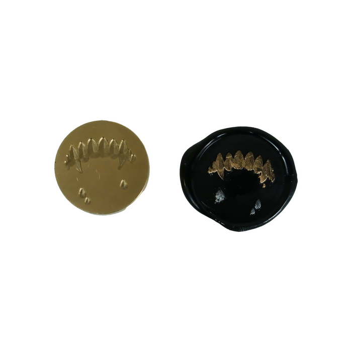 Papier Plume wax seal featuring a fang design, showcasing a detailed, high-quality wax seal with fang motif on a neutral background.