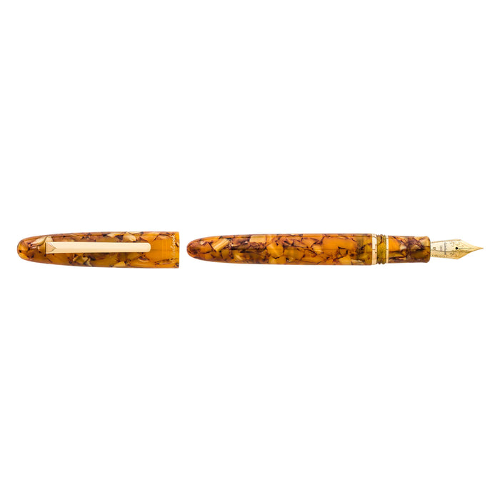 Esterbrook Estie fountain pen with gold fittings, featuring a honeycomb patterned barrel and smooth ink nib for writing elegance.