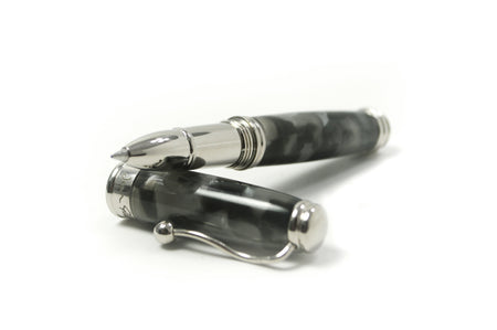 Jean-Pierre Lepine Indigo Classic Murano rollerball pen with black tortoise-patterned body and gold accents.