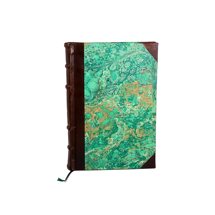 Leather journal with marbled paper pages and old world spine, handcrafted by Il Cartiglio for writing and sketching.