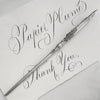 Le Potier D'etain pewter calligraphy dip pen with fleur-de-lys design, featuring a detailed handle and nib for elegant writing.