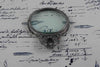Large pewter magnifying glass with handle and acanthus detail by Le Potier D'etain, showcasing intricate craftsmanship and antique design.