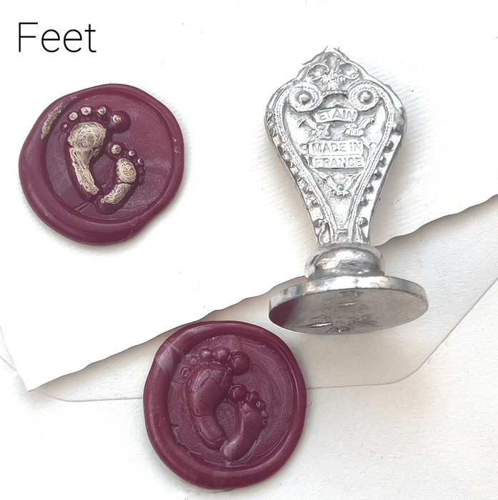 Le Potier D'etain wax seal with anchor design, showcasing detailed craftsmanship on a metallic wax seal for sealing documents.