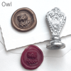 Le Potier D'etain wax seal with anchor design, showcasing detailed craftsmanship on a gold-colored wax seal.