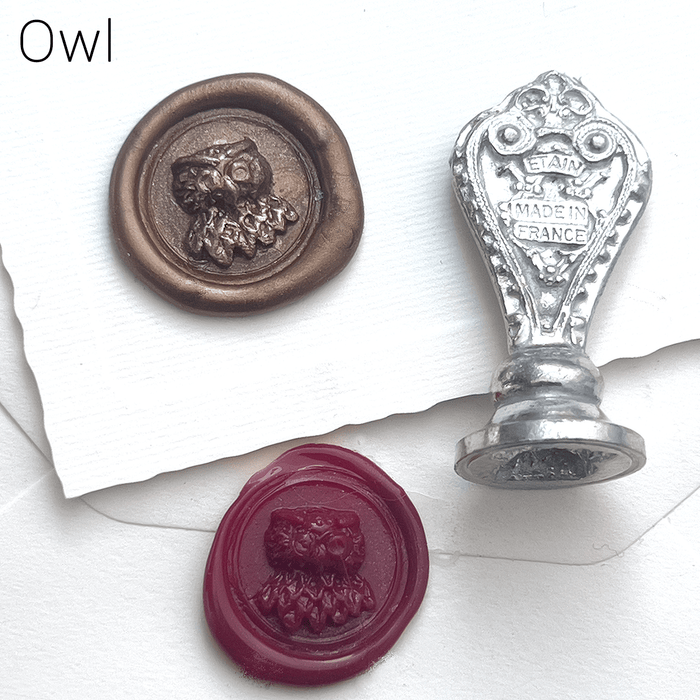 Le Potier D'etain wax seal with anchor design, showcasing detailed craftsmanship on a gold-colored wax seal.