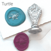 Le Potier D'etain wax seal with anchor design, showcasing detailed craftsmanship on a golden wax seal for sealing letters.