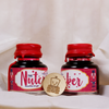 Papier Plume Nutcracker Fountain Pen Ink in a limited edition glass bottle with elegant labeling and vibrant ink color.