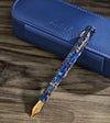 Esterbrook Niblet fountain pen with a sleek black body and gold accents, featuring a close-up of the fine nib.