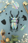 Small Paper Stag Beetle craft by Assembli in Caribbean green metallic paper, showcasing detailed insect design for creative projects.