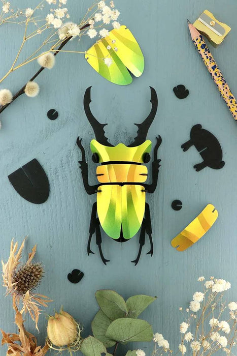 Small Paper Stag Beetle craft by Assembli in Caribbean green metallic paper, showcasing detailed insect design.