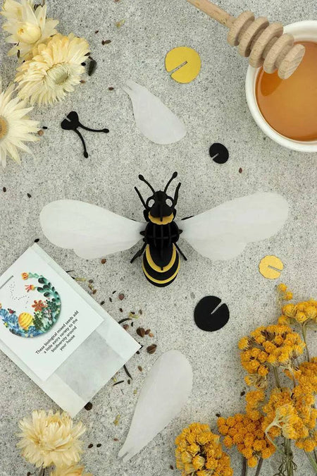 Gold satin paper craft of a honey bee made with Assembli Paper Honey Bee craft supplies, showcasing detailed honey bee design.