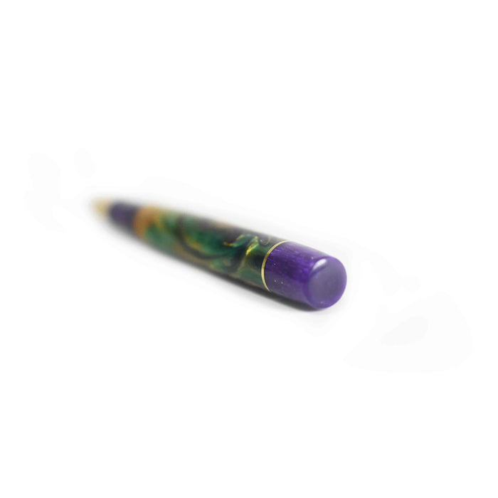 Papier Plume x Hardy Penwrights Krewe of Calliope fountain pen with gold accents and an elegant design, showcasing its fine nib and craftsmanship.