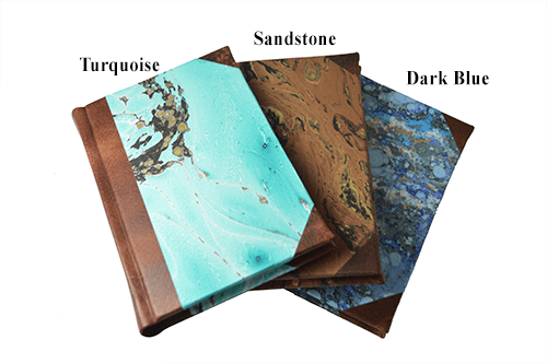 Handcrafted leather-trimmed journal with marbled paper and modern spine, small lined pages, by Il Cartiglio.