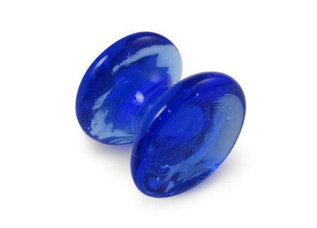 Amber glass pen rest by Papier Plume with a smooth, curved design for holding pens and writing tools.