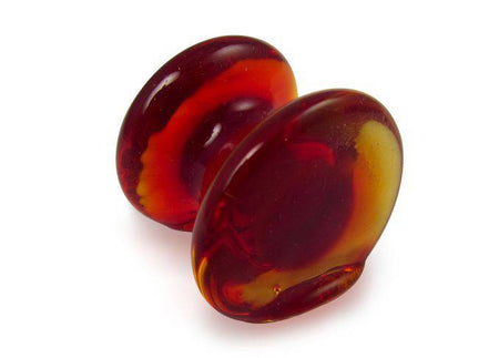 Amber glass pen rest from Papier Plume, elegant pen holder with smooth, transparent design for writing accessories.