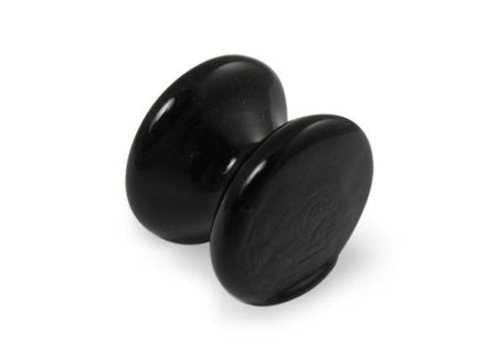 Amber glass pen rest by Papier Plume, elegant and smooth, designed to hold pens securely on a desk or workspace.
