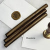 Black pliable sealing wax sticks by Papier Plume, 7 inches long, suitable for sealing and craft projects.