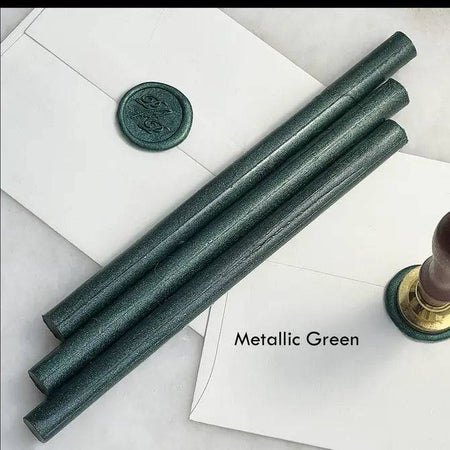 Black pliable sealing wax sticks by Papier Plume, 7 inches long, used for sealing envelopes and decorative craft projects.