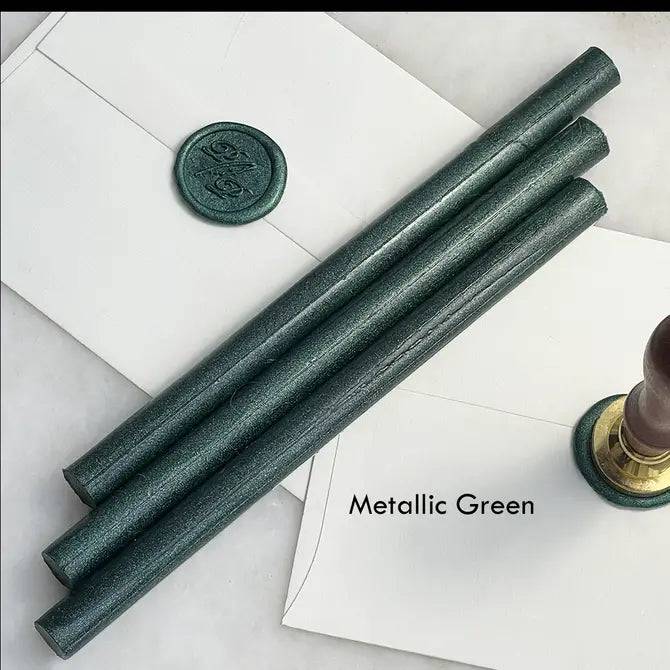 Black pliable sealing wax sticks by Papier Plume, 7 inches long, used for sealing envelopes and decorative craft projects.