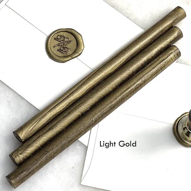 Black pliable sealing wax sticks by Papier Plume, 7 inches long, ideal for sealing envelopes and adding vintage charm to crafts.