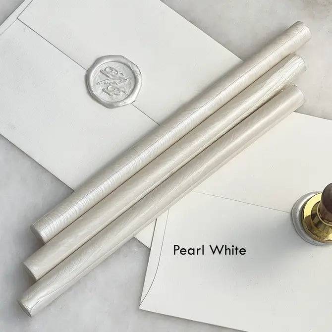 Black pliable sealing wax sticks by Papier Plume, 7 inches long, used for sealing envelopes and decorative crafts.