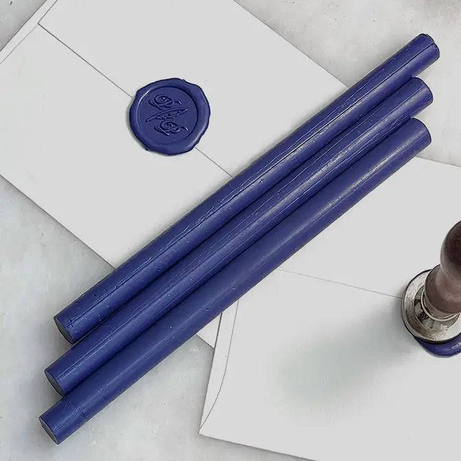 Black pliable sealing wax sticks by Papier Plume, 7 inches long, for sealing and decorative wax applications.