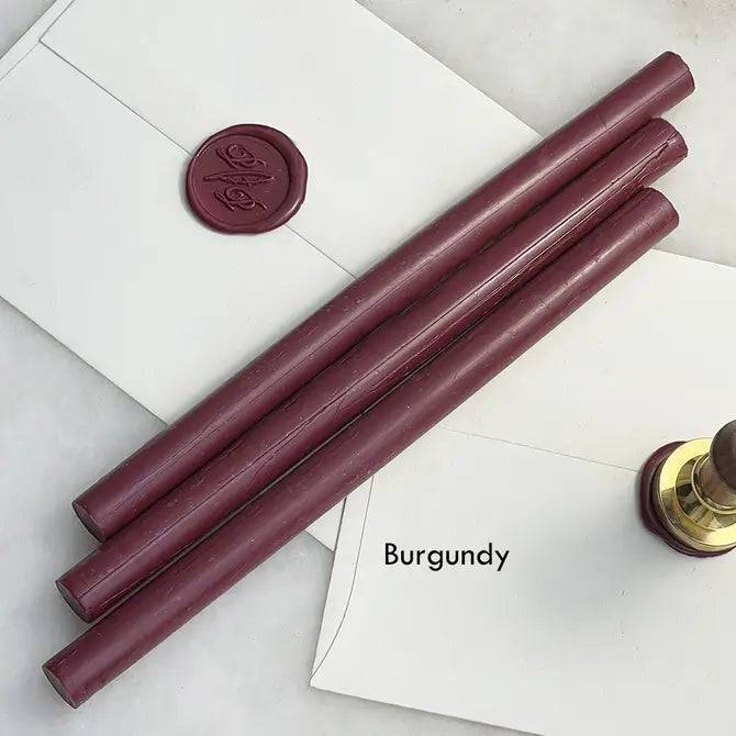 Black pliable sealing wax sticks by Papier Plume, 7 inches long, ideal for sealing and decorative crafts.