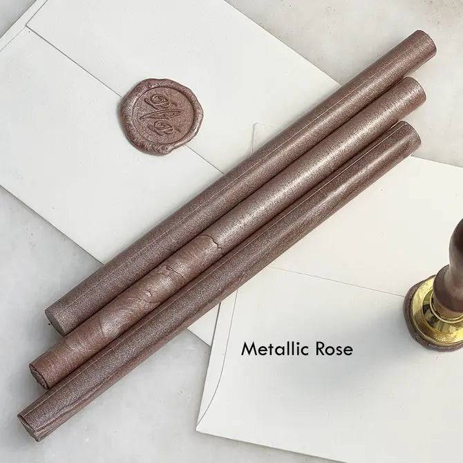 Black pliable sealing wax sticks from Papier Plume, 7 inches long, ideal for sealing envelopes and crafts.