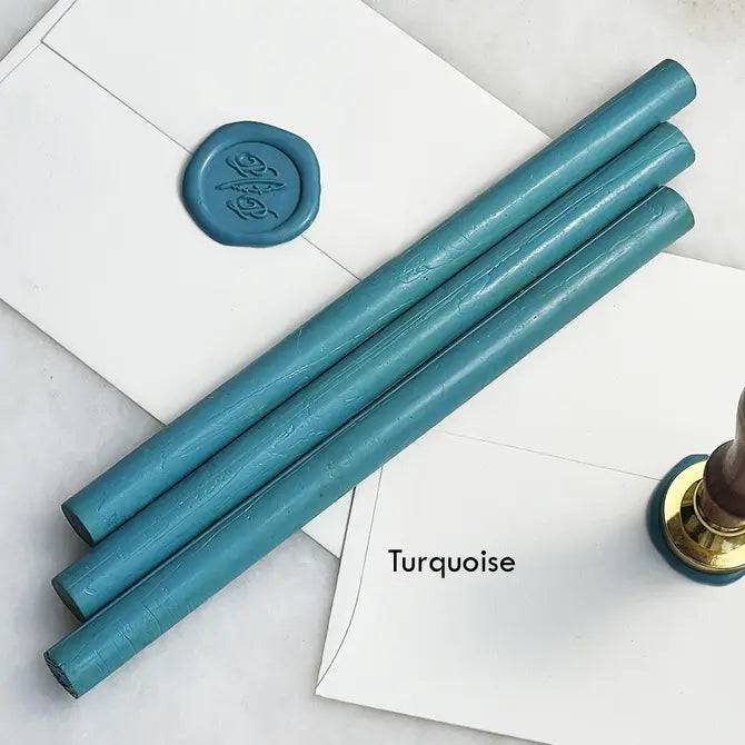 Black pliable sealing wax sticks by Papier Plume, 7 inches long, ideal for sealing and decorative wax applications.