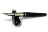 Pineider Avatar UR Fountain Pen in Graphene Black with gold accents, showcasing its elegant design and fine nib.