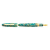 Esterbrook Estie fountain pen with sea glass body and gold fittings, showcasing its elegant design and smooth writing tip.