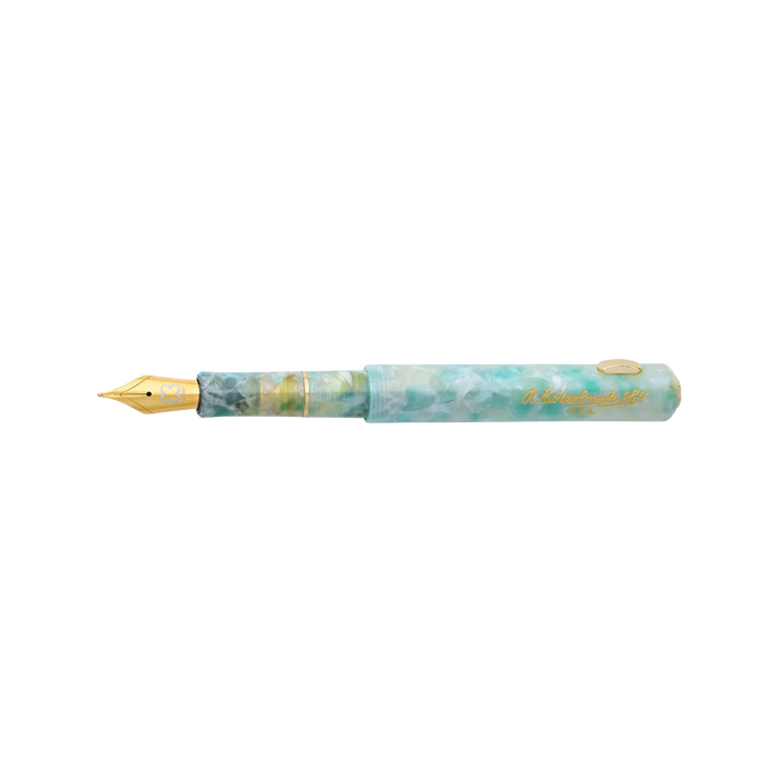 Esterbrook Niblet fountain pen with a sleek black barrel and gold accents, open to show the nib and elegant design.